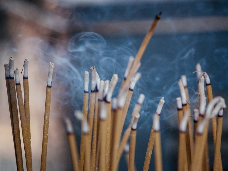 Burning incense for Tomb Sweeping Day