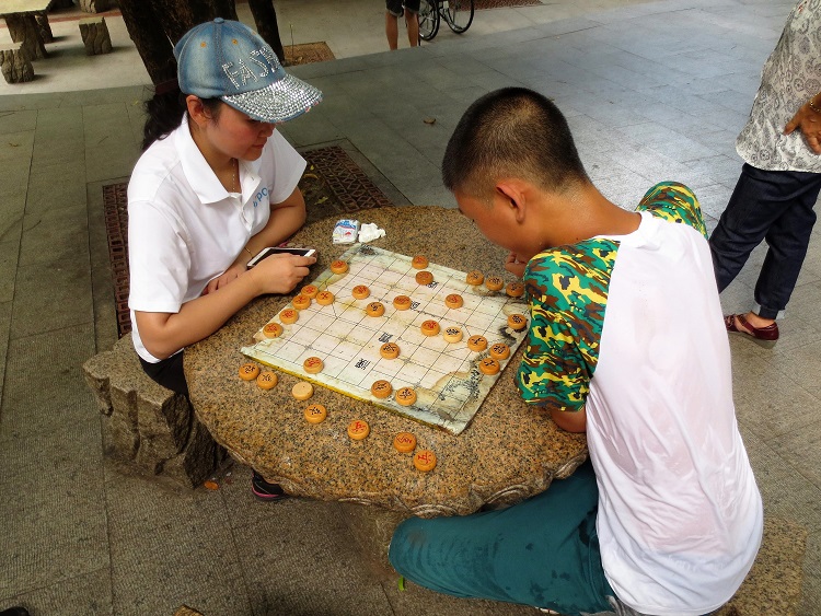 Watching people play chess while teaching in Shenzhen