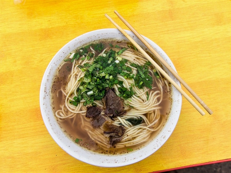 You can try Lamian hand-pulled noodles while teaching in China.