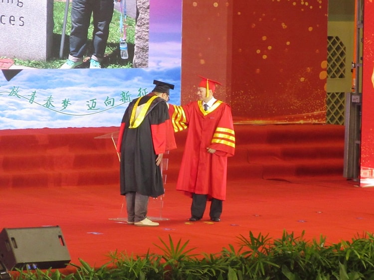 Being awarded at a postgraduate graduation ceremony China